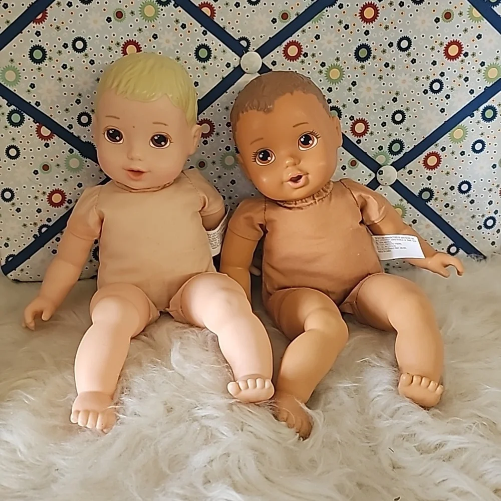 2 cute soft body dolls blonde hair and dark